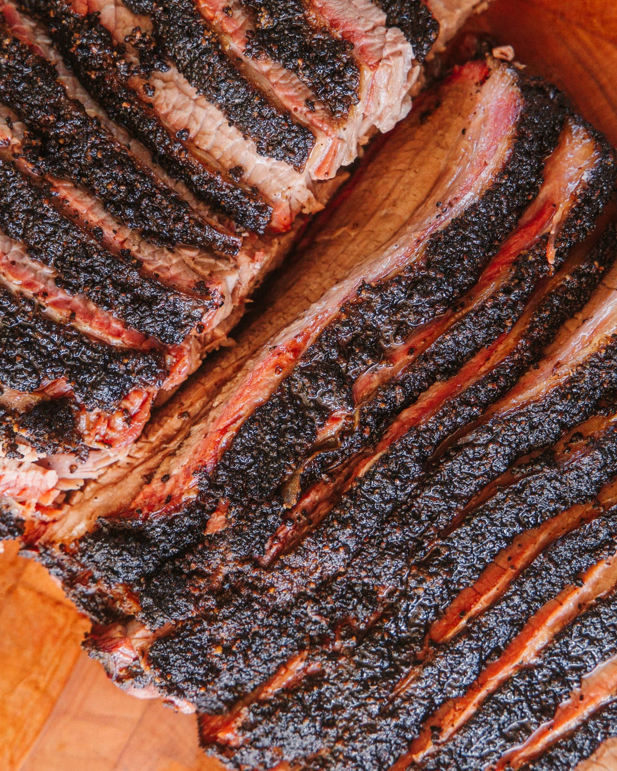 Sliced brisket fanned on the board