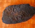 Whole smoked brisket from Hurtado Barbecue, bark side up