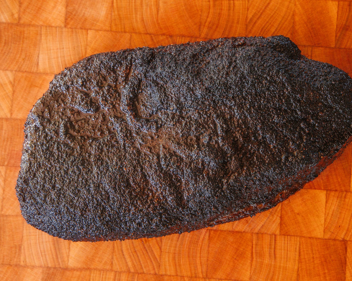 Whole smoked brisket from Hurtado Barbecue, bark side up