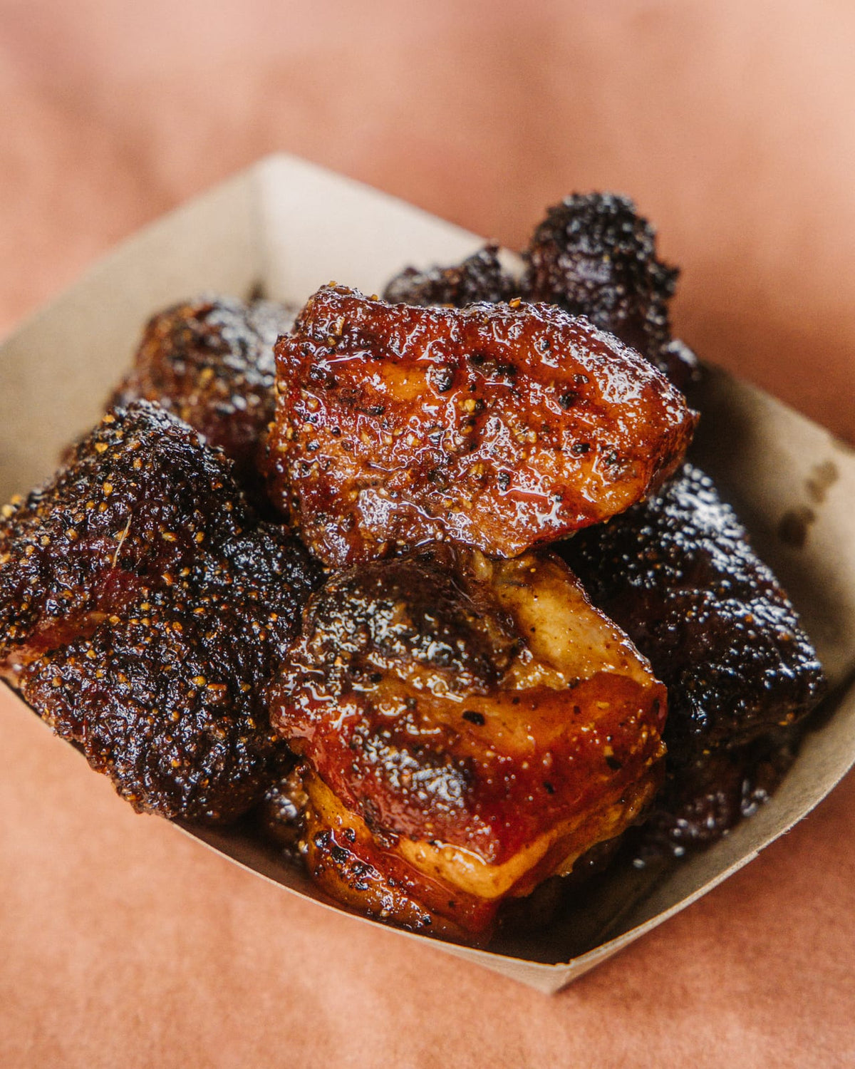 Pork belly burnt ends on a tray