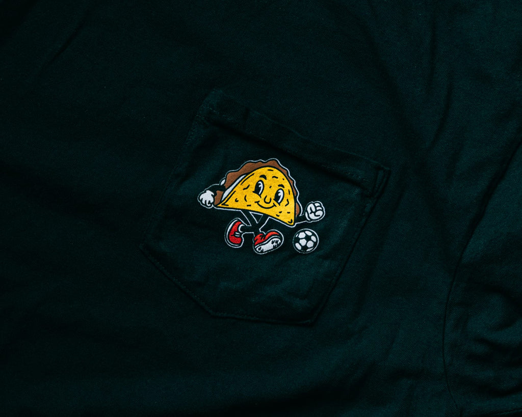 Soccer Taco Tee in black, close-up of the chest-pocket taco mascot