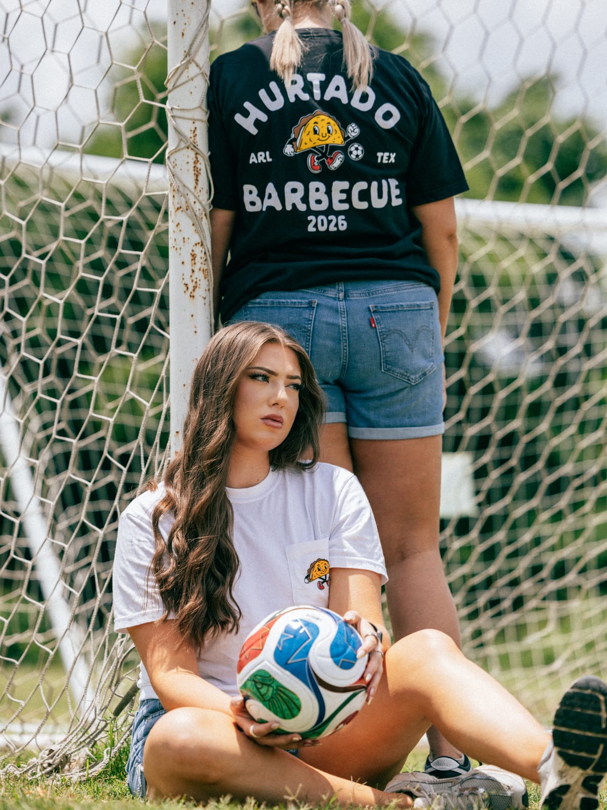 Hurtado Barbecue soccer tees, white and black colorways at the goal