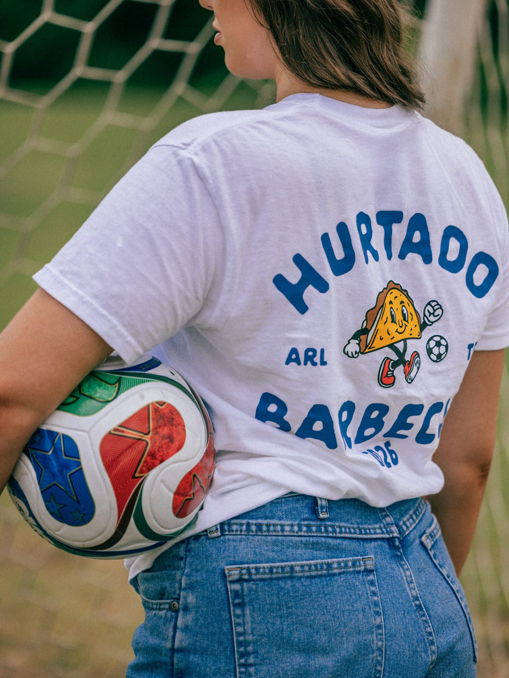 Soccer Taco Tee in white, back badge worn