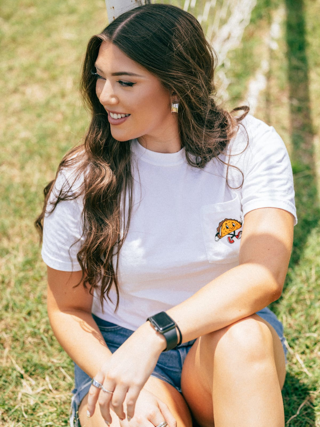Soccer Taco Tee in white, worn outdoors