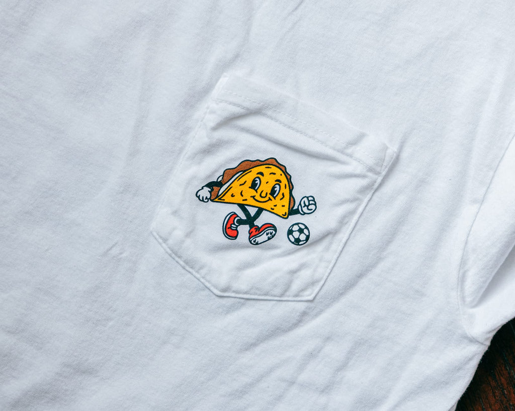 Soccer Taco Tee in white, close-up of the chest-pocket taco mascot