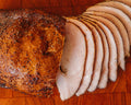 Whole smoked turkey breast, sliced at one end